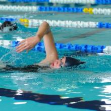 Person swimming in Iffley Pool